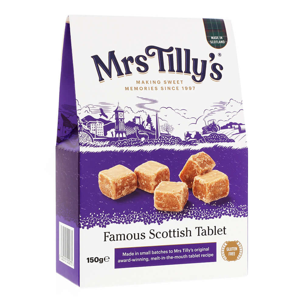 A 150g box of Mrs Tilly's Famous Scottish Tablet, featuring a purple and white design with an illustration of a Scottish village. The packaging highlights the gluten-free, award-winning, melt-in-the-mouth traditional tablet made in small batches.