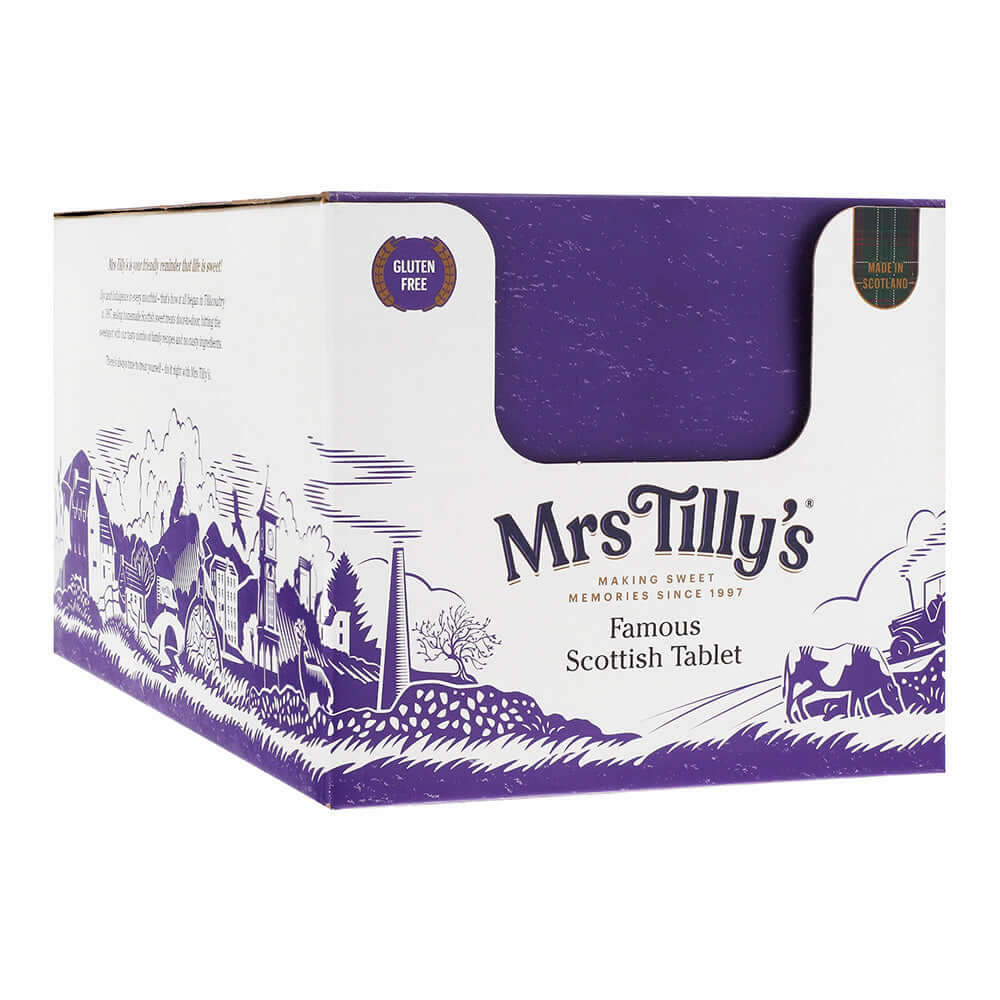 Closed retail display box of Mrs Tilly's Famous Scottish Tablet, featuring a purple and white design with an illustrated Scottish village scene. The packaging highlights that the product is gluten-free and made in Scotland.